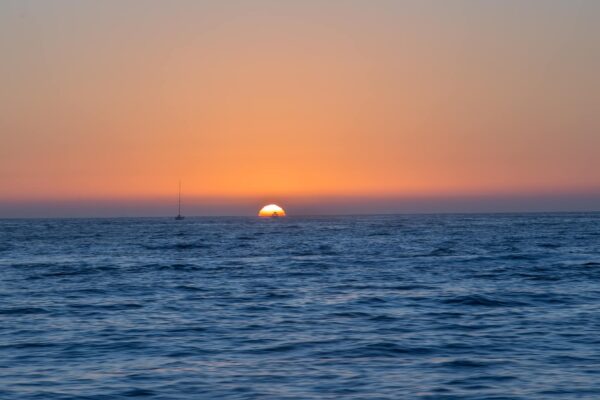 Sun sets over the pacific ocean